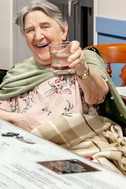A Care Home resident at Brighouse Care Home, West Yorkshire enjoying a drink