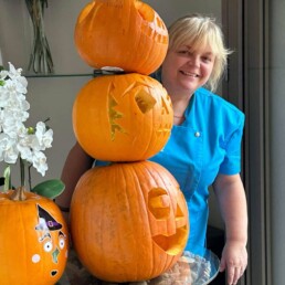 A Yorkshire Care Worker creating pumpkins as an activity at a Care Home