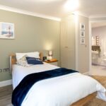 Bedroom with fitted wardrobe and en-suite at Whitby Court Care Home, Whitby
