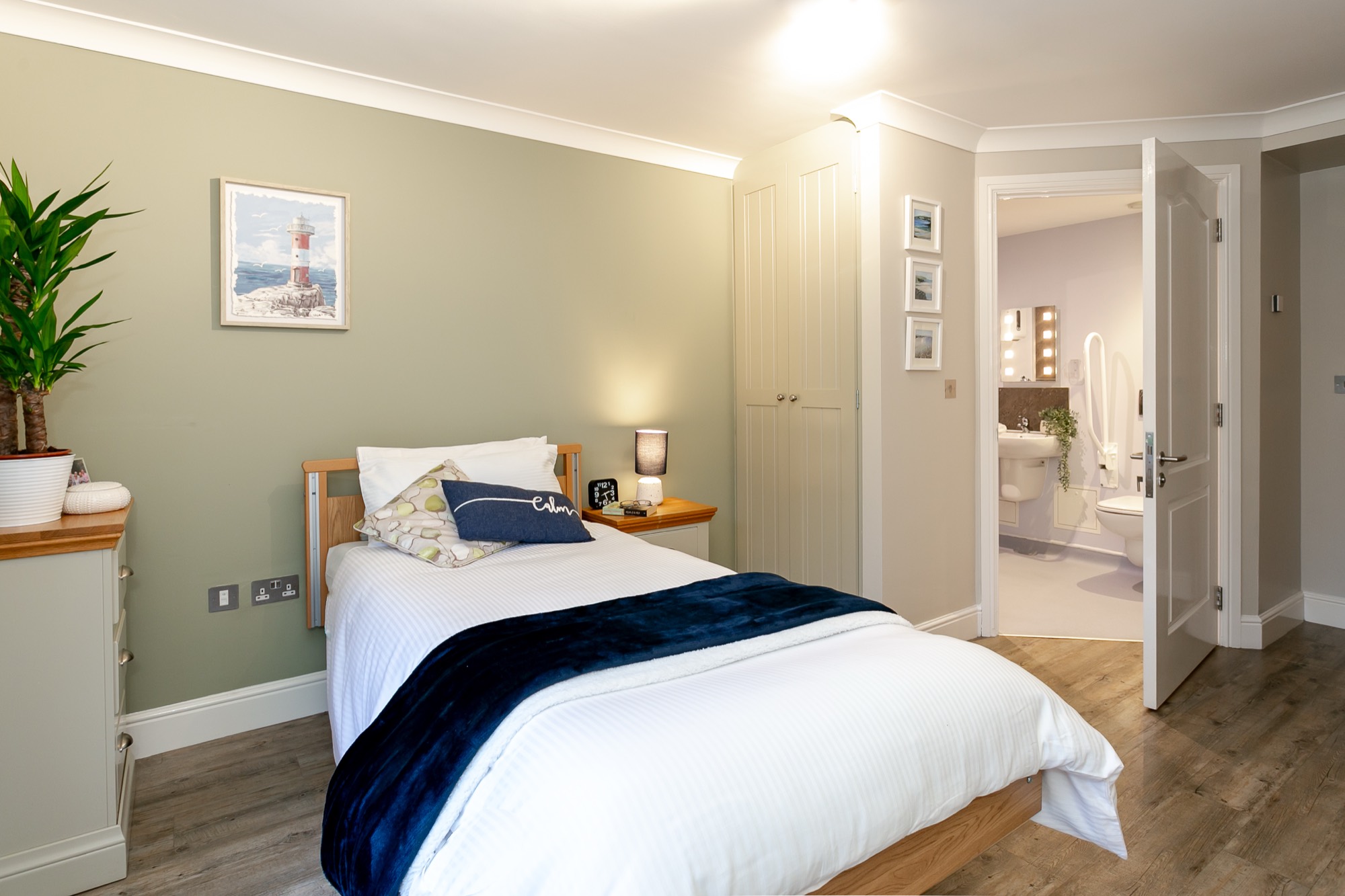 Bedroom with fitted wardrobe and en-suite at Whitby Court Care Home, Whitby